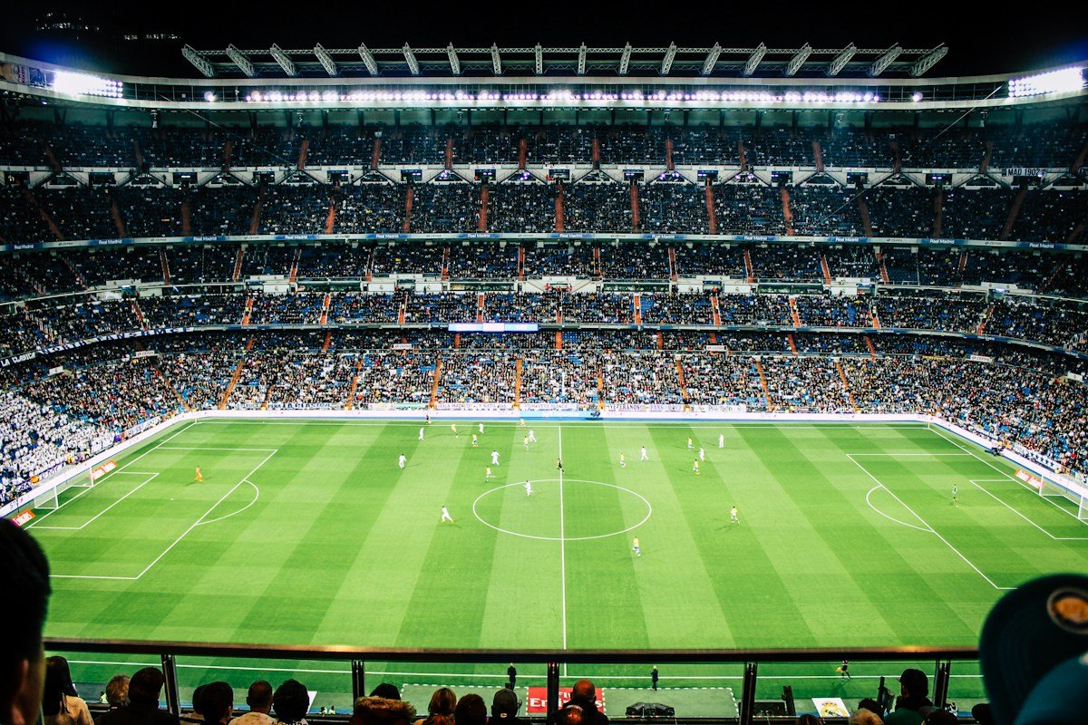 Live football match in a packed stadium